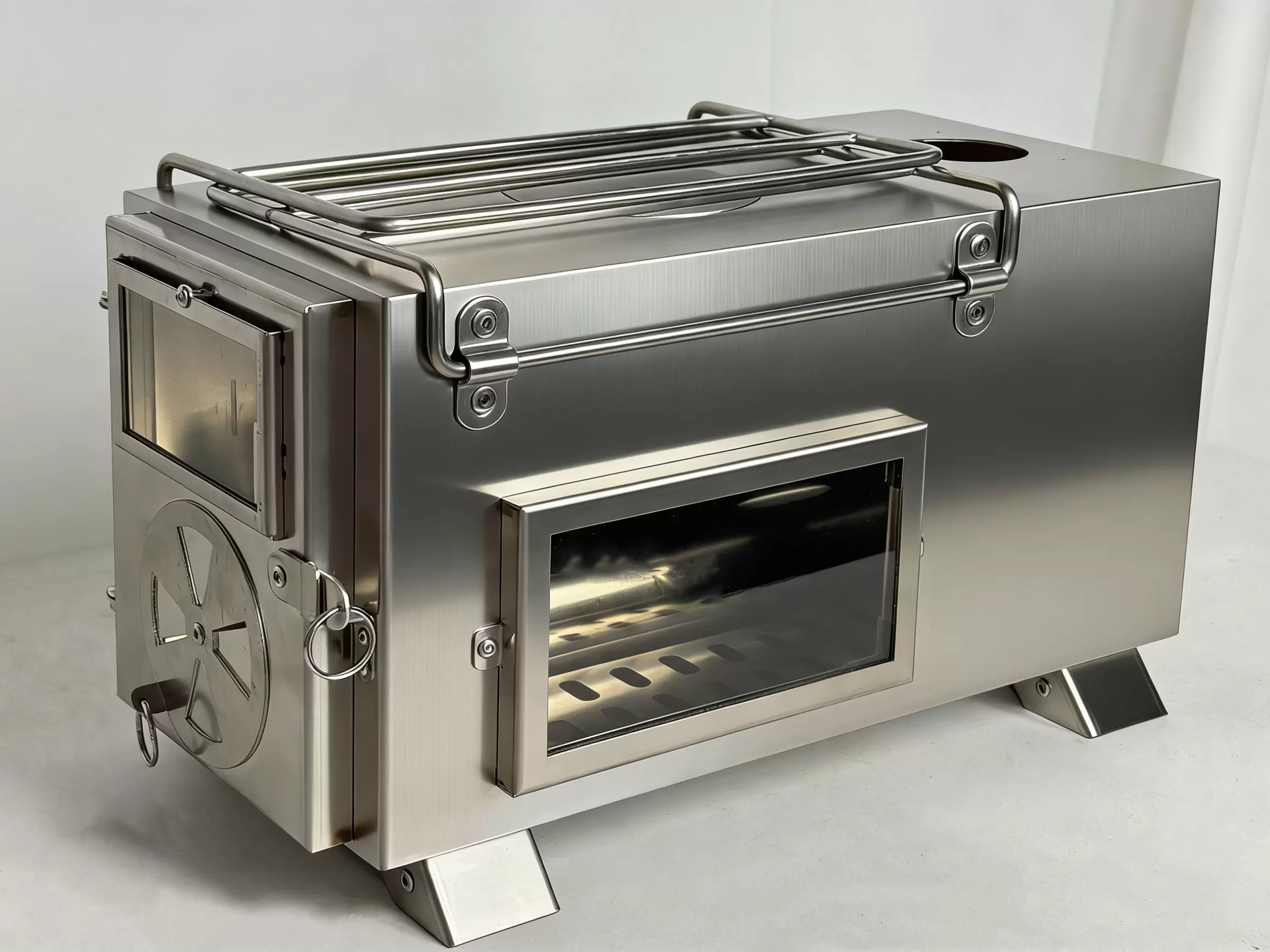 Po&ecirc;le &agrave; bois portable pour le camping